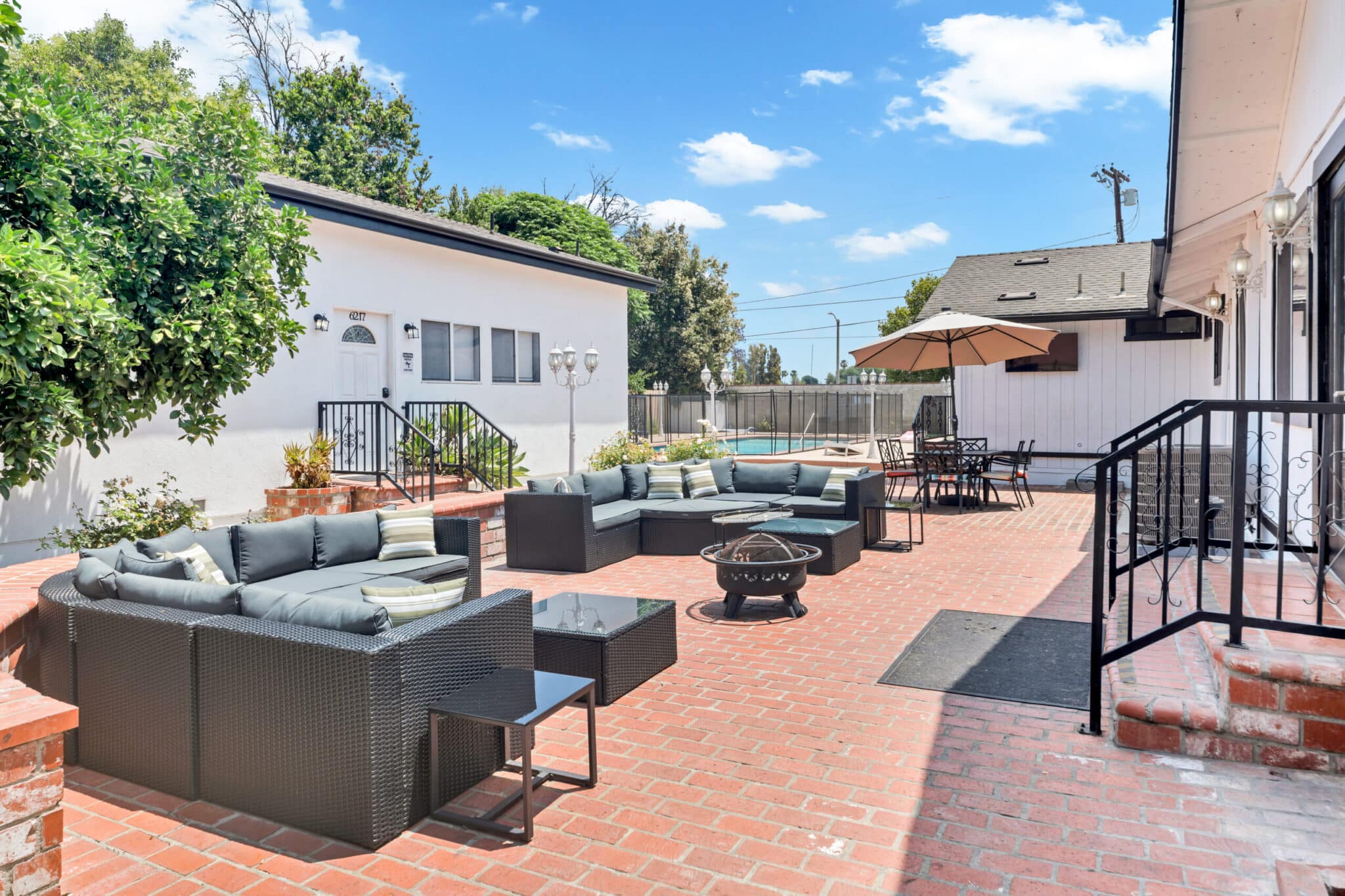Outdoor courtyard sectional and bonfire pit gathering space at Northridge Addiction Treatment Center