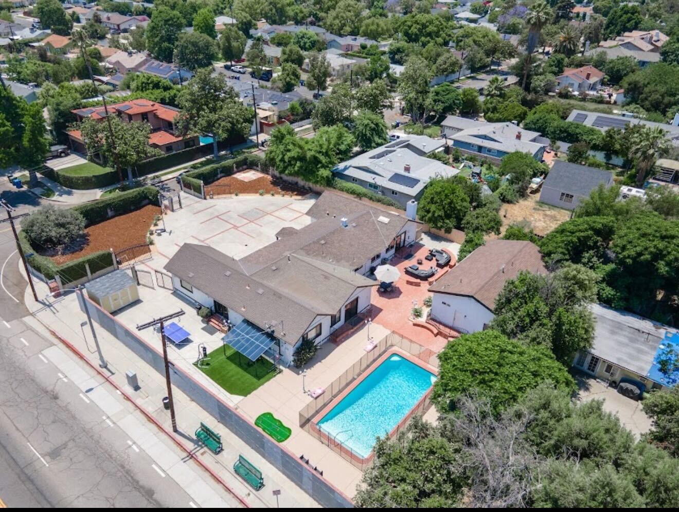 Aerial view of the private gated Northridge Addiction Treatment Center residential estate and swimming pool in Encino, Los Angeles